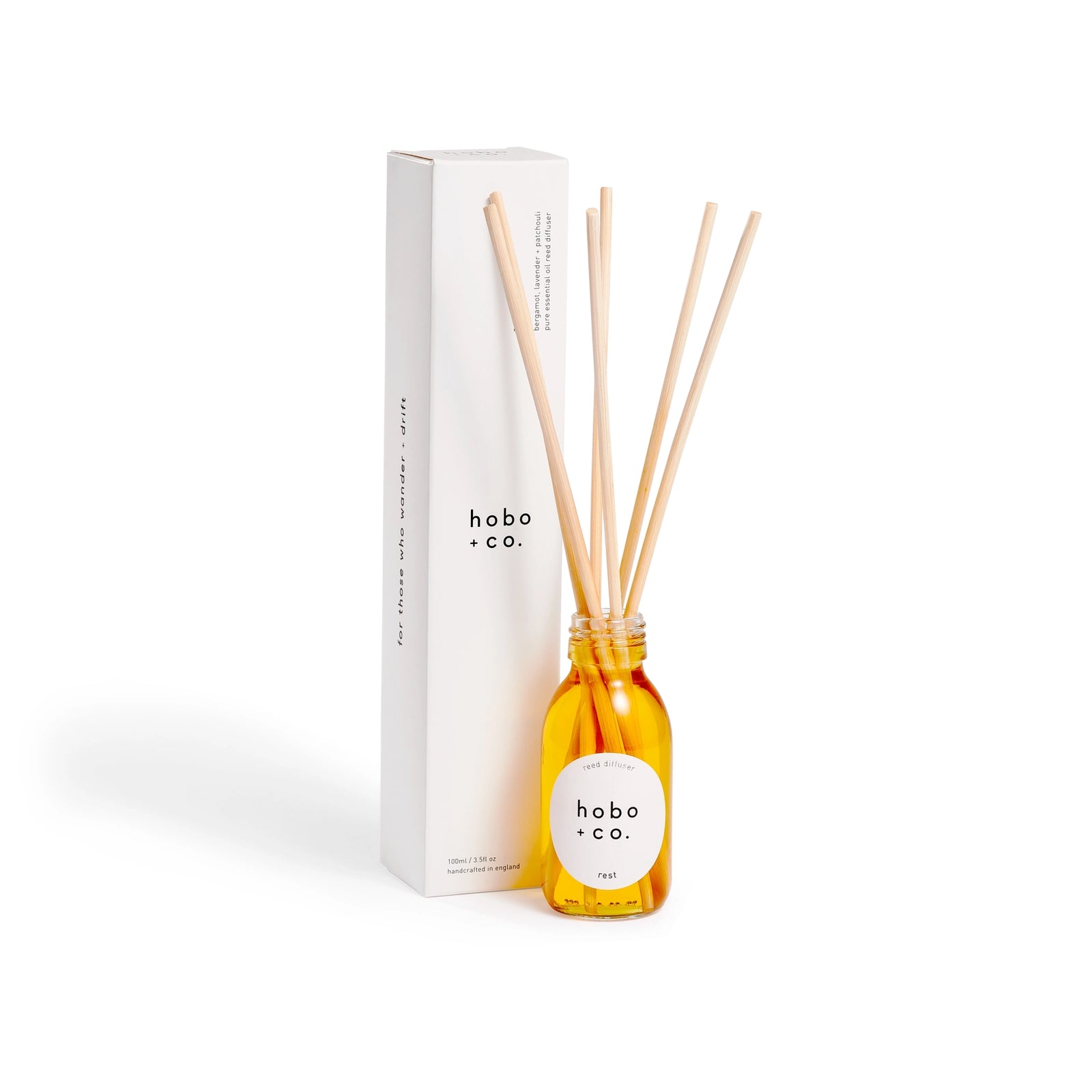 Hobo + Co diffuser bottle with wooden sticks and packaging on a white background
