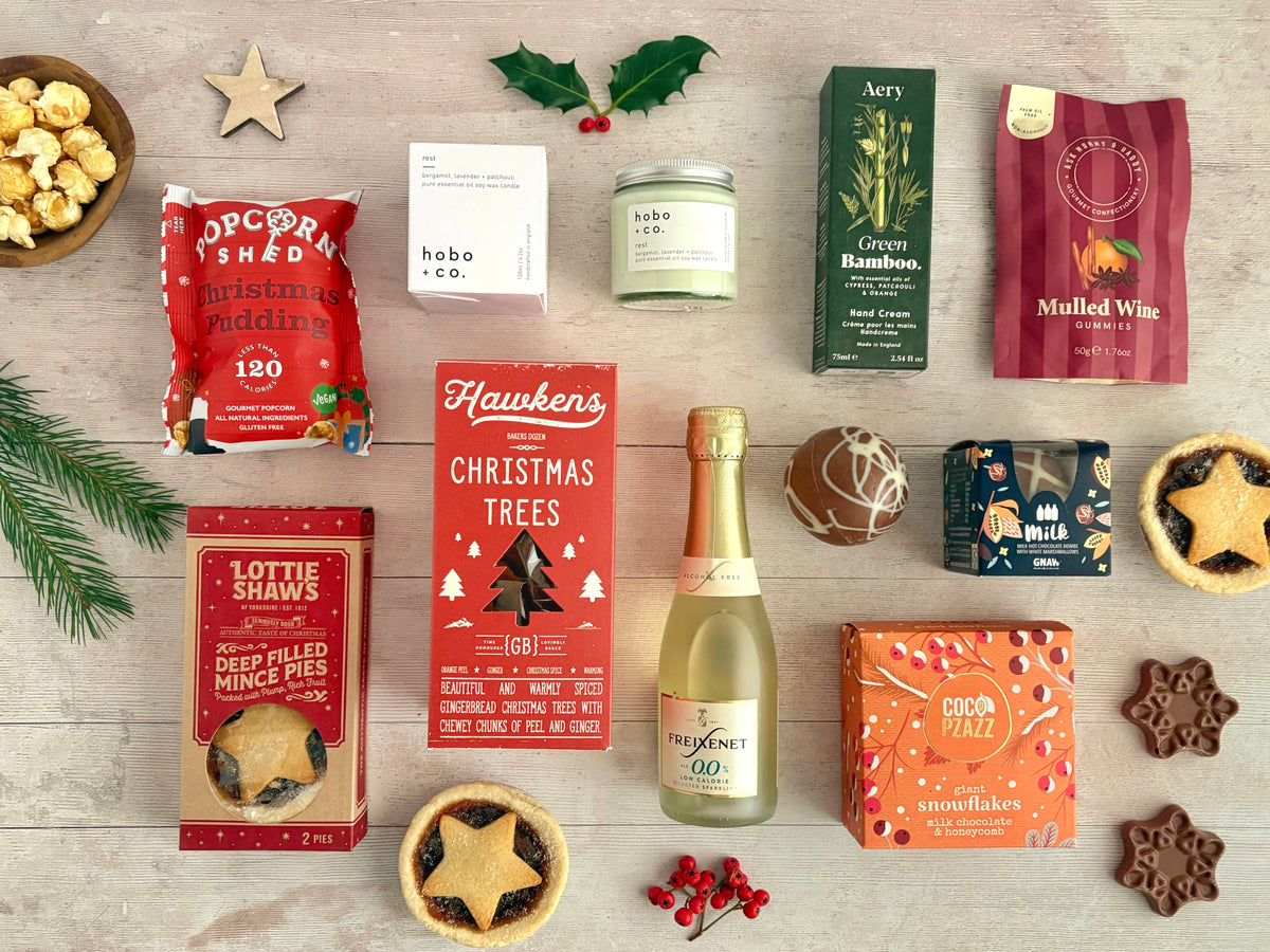 Seasons Treatings Christmas Food Hamper with candle, handcream, chocolate, gingerbread, mince pies, Christmas Pudding popcorn, hot chocolate, gummy sweets