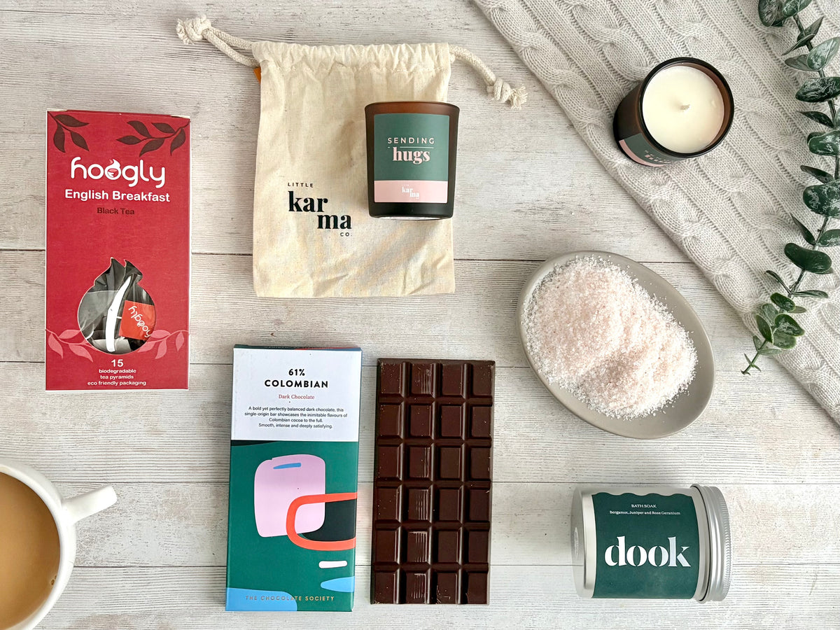 Sending Hugs with English Breakfast Tea wholeleaf pyramids glass votive soy candle with 'Sending Hugs' label, Dook bath salts in aluminium tin, chocolate bar